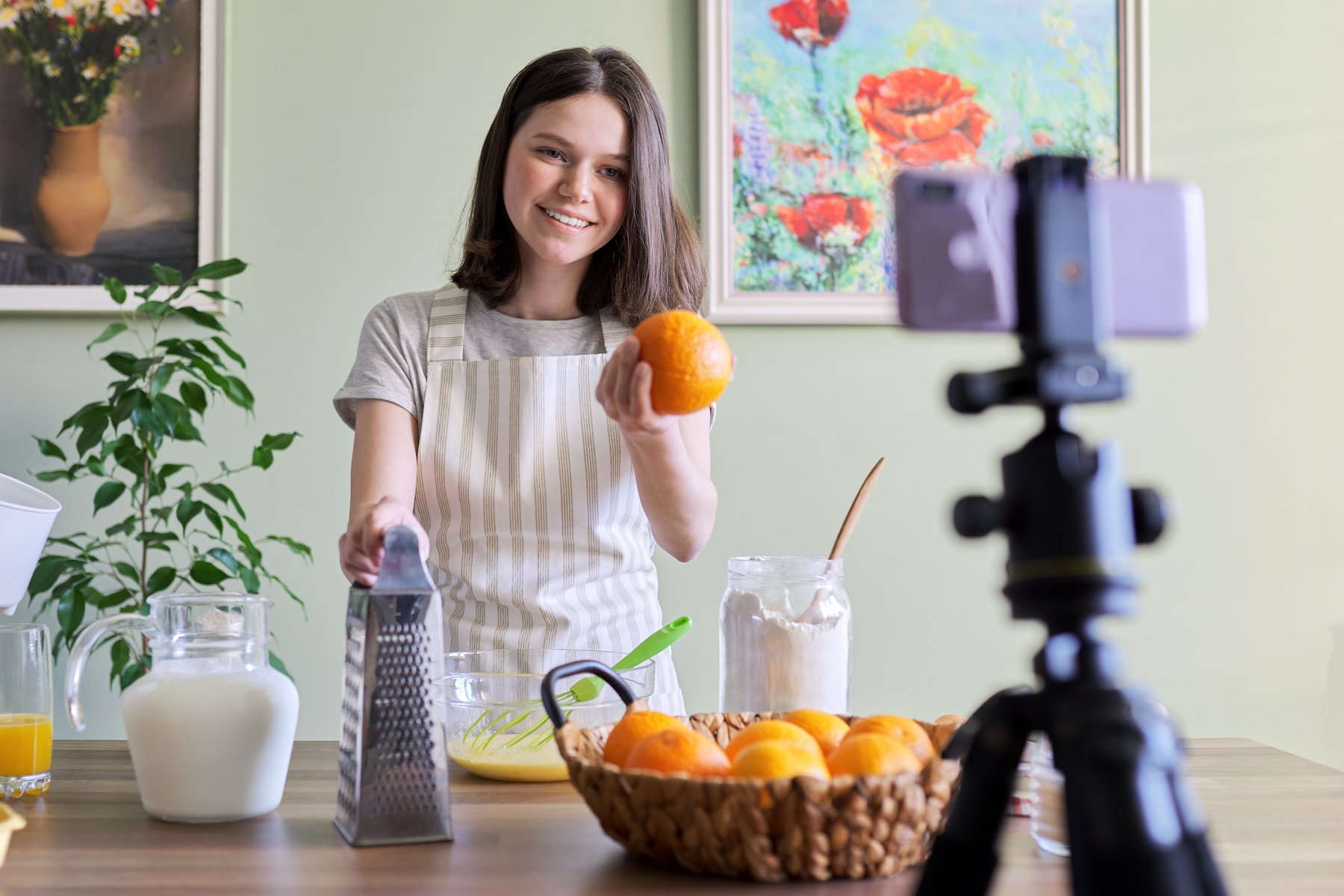 Girl Teenager Food Blogger Recording Recipe for Cooking Orange Pancakes